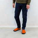 Person wearing orange Tabi Shoes "U-ten" in a casual standing pose indoors