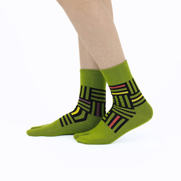 Person wearing long green Tabi Socks " Sankuzushi ", right side view