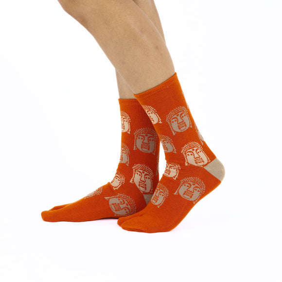 Person wearing long orange Tabi Socks " Nara Daibutsu ", right side view
