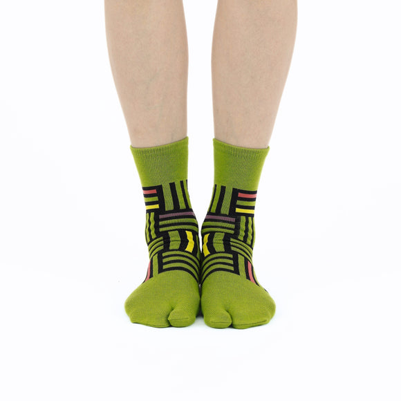 Person wearing long green Tabi Socks " Sankuzushi ", front view