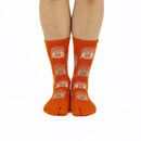 Person wearing long orange Tabi Socks " Nara Daibutsu ", front view
