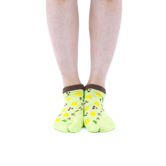 Person wearing short green Tabi Socks " Shika-no Ashiato ", front view