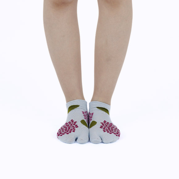 Person wearing short blue Tabi Socks " Ajisai ", front view