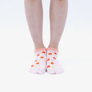 Person wearing short pink Tabi Socks " Shika-no Ashiato ", front view