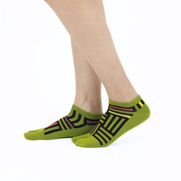 Person wearing short green Tabi Socks " Sankuzushi ", right side view