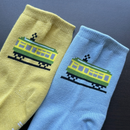 Pixel Densha tabi socks featuring a pixel-style train design in blue and yellow