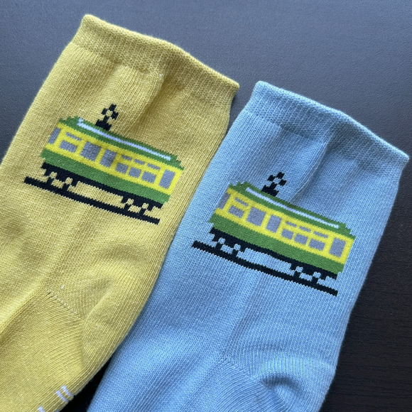 Pixel Densha tabi socks featuring a pixel-style train design in blue and yellow