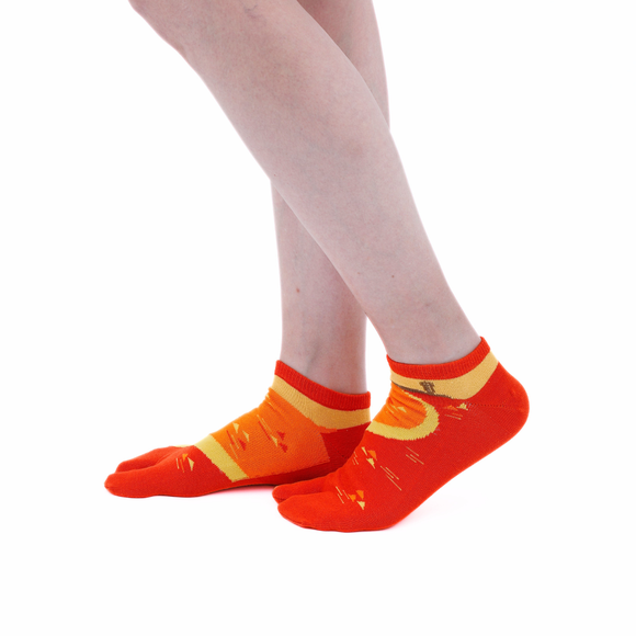 Person wearing short orange Tabi Socks " Enoshim ", right side view