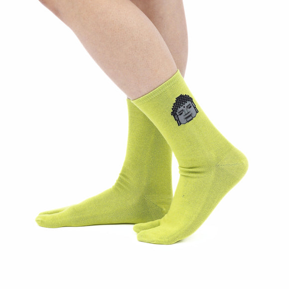 Person wearing long green Tabi Socks " Pixel Daibutsu ", right side view