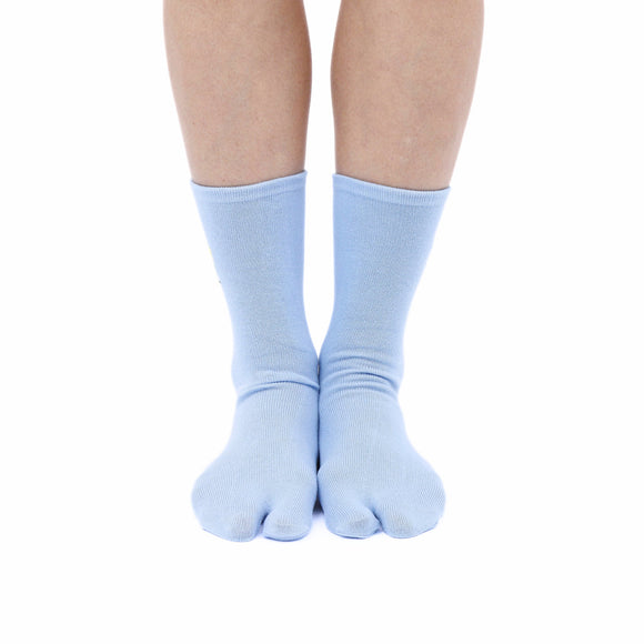 Person wearing long blue Tabi Socks " Pixel Densha ", front view