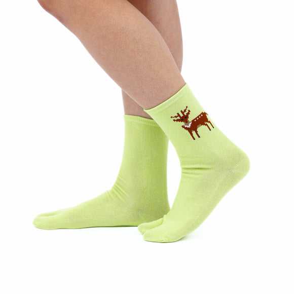 Person wearing long green Tabi Socks " Pixel Shika ", right side view