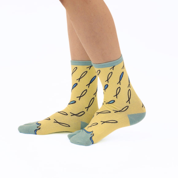 Person wearing long yellow Tabi Socks " Shirasu2", right side view