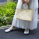 tabiRela split-toe shoes with a woven fabric pattern, shown worn with a long white skirt for a relaxed, everyday look.