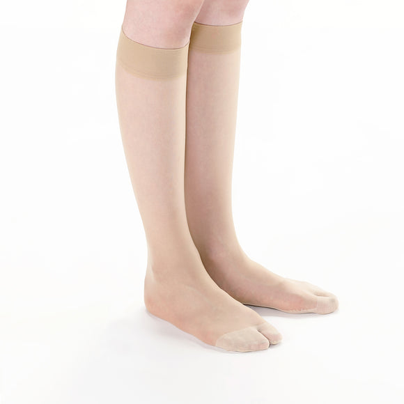 Person wearing Tabi-style stockings " ＆TABI ", right side view