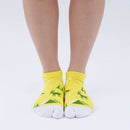 Person wearing short yellow Tabi Socks " Mikasayama ", front view