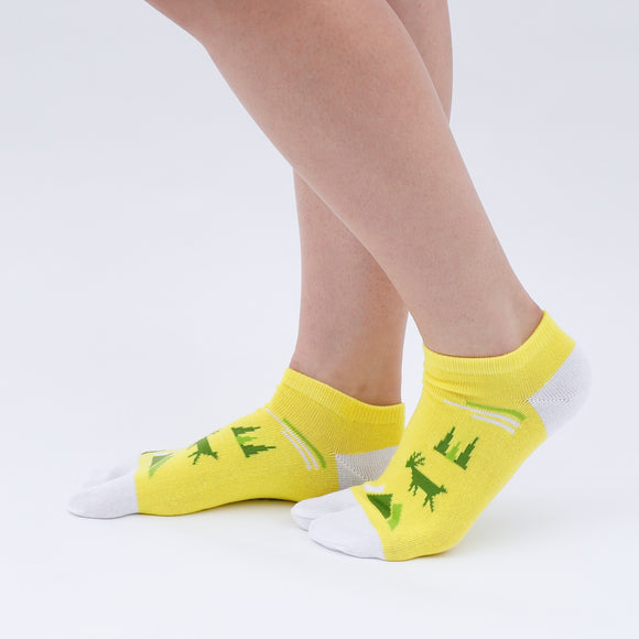 Person wearing long yellow Tabi Socks " Mikasayama ", front view