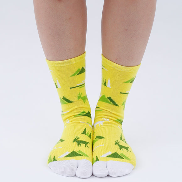 Person wearing long yelllow Tabi Socks " Mikasayama ", right side view