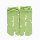 Back view of short green Tabi Socks " Shika Hashiru "