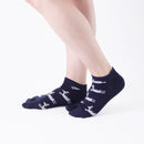 Person wearing short navy Tabi Socks " Shika Hashiru ", right side view