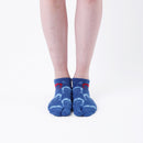 Person wearing short blue Tabi Socks " Kamakura Daibutsu ", front view