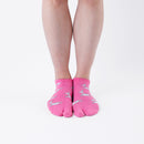 Person wearing short pink Tabi Socks " Shika Hashiru ", front view