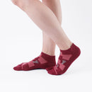 Person wearing short dark red Tabi Socks " Shika Nozoku ", right side view