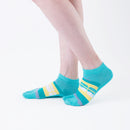 Person wearing short green Tabi Socks " Densha ", right side view