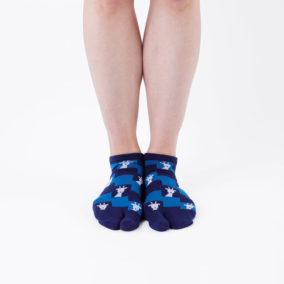 Person wearing short blue Tabi Socks " Shika Nozoku ", front view