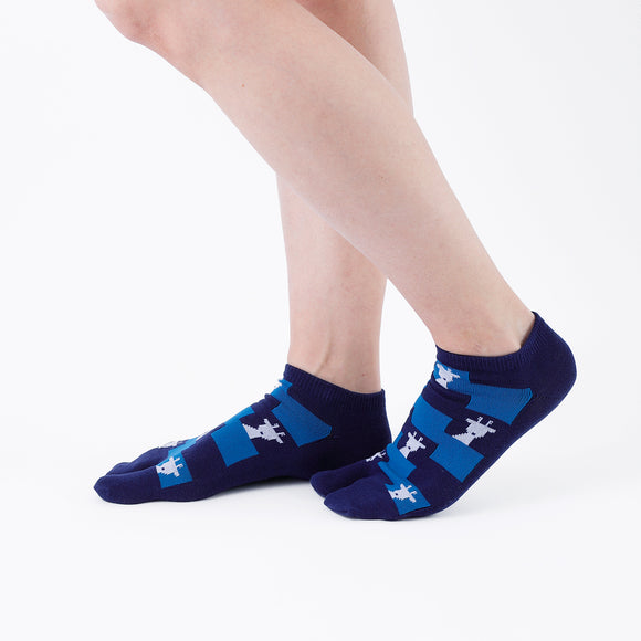 Person wearing short blue Tabi Socks " Shika Nozoku ", right side view