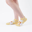 Person wearing short yellow Tabi Socks " Hato ", right side view