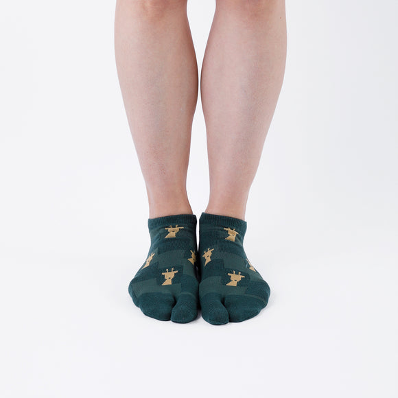 Person wearing short green Tabi Socks " Shika Nozoku ", front view