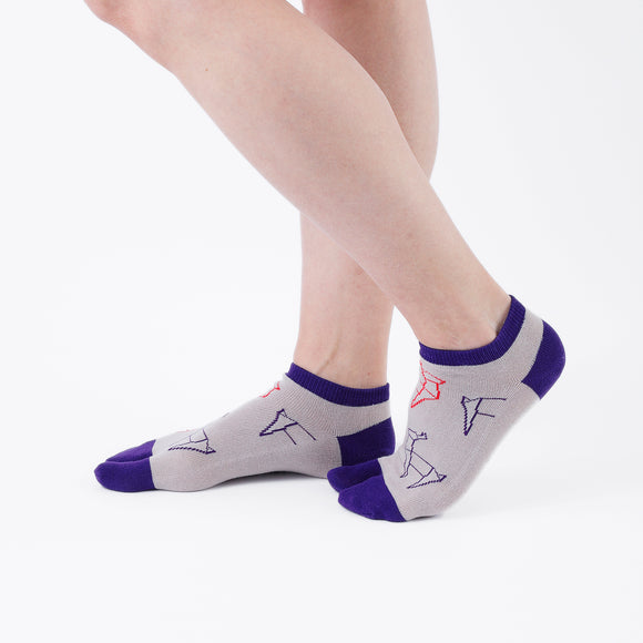 Person wearing short beige Tabi Socks " Shika Origami ", right side view