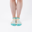 Person wearing short light yellow Tabi Socks " Shika Origami ", front view