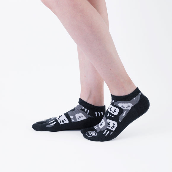 Person wearing short black Tabi Socks " Daruma ", right side view
