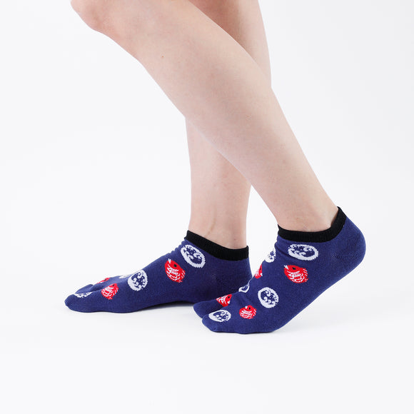 Person wearing short navy Tabi Socks " Tai ", right side view
