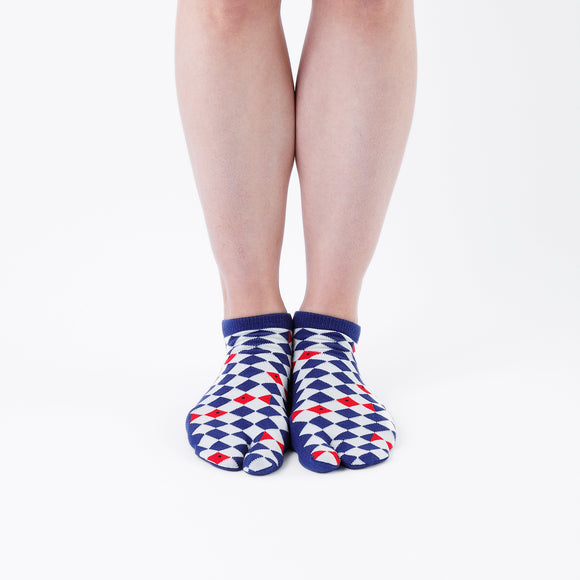 Person wearing short blue Tabi Socks " Kingyo 2 ", front view