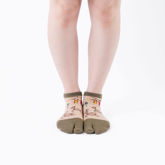 Person wearing short green Tabi Socks " Nara-e ", front view