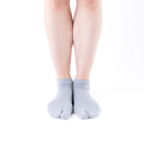 Person wearing short gray Tabi Socks "TABI-JI", front view