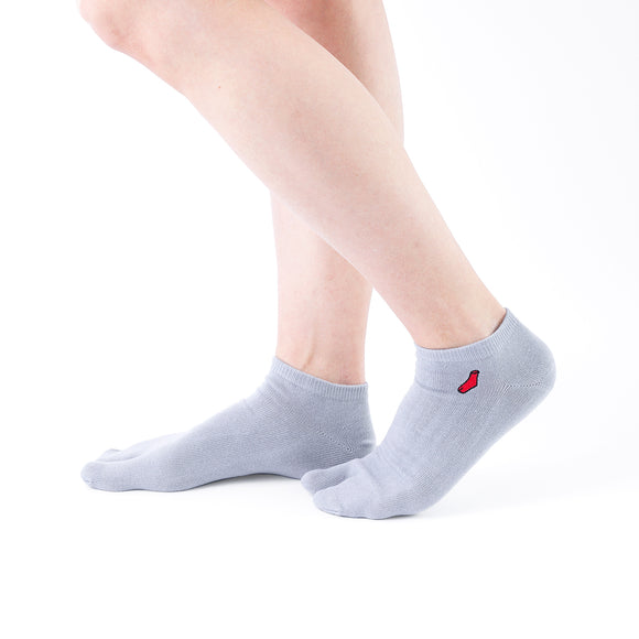 Person wearing short gray Tabi Socks "TABI-JI", right side view