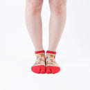 Person wearing short red Tabi Socks " Nara-e ", front view