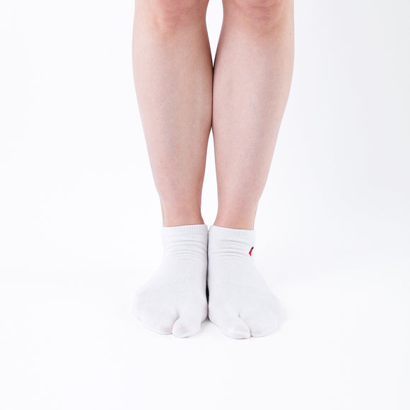 Person wearing short white Tabi Socks "TABI-JI", front view