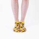Person wearing short yellow Tabi Socks " Chigiri-e ", front view