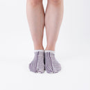 Person wearing short purple Tabi Socks " Hyoshigi ", front view