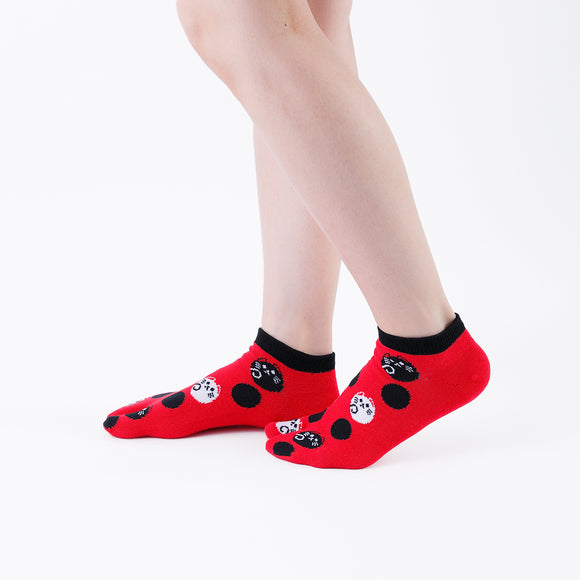 Person wearing short red Tabi Socks " Maneki Neko ", right side view