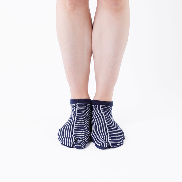 Person wearing short navy Tabi Socks " Hyoshigi ", front view
