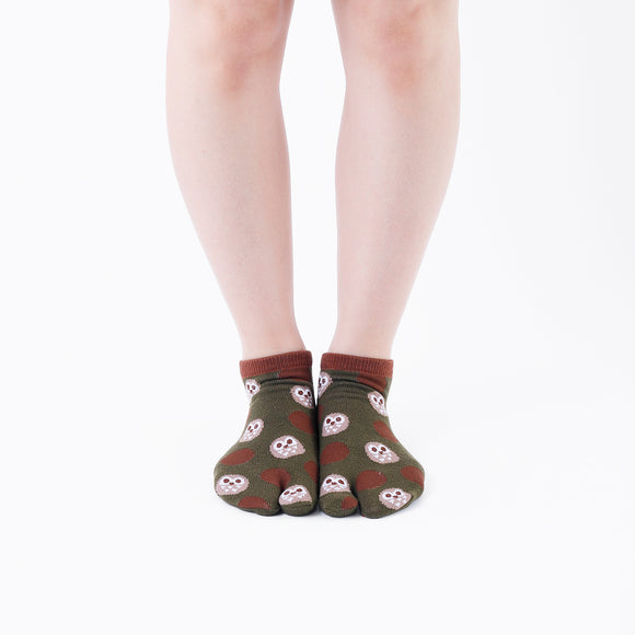 Person wearing short dark green Tabi Socks " Fukuro ", front view