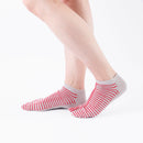 Person wearing short red Tabi Socks " Hyoshigi ", right side view