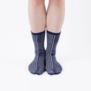 Person wearing long navy Tabi Socks " Hyoshigi ", front view