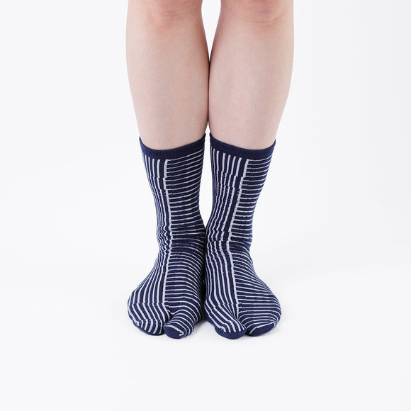 Person wearing long navy Tabi Socks " Hyoshigi ", front view