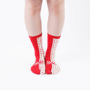 Person wearing long red Tabi Socks " Goen ", front view